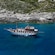 A traditional wooden boat sailing the Aegean Sea off Rhodes, Greece